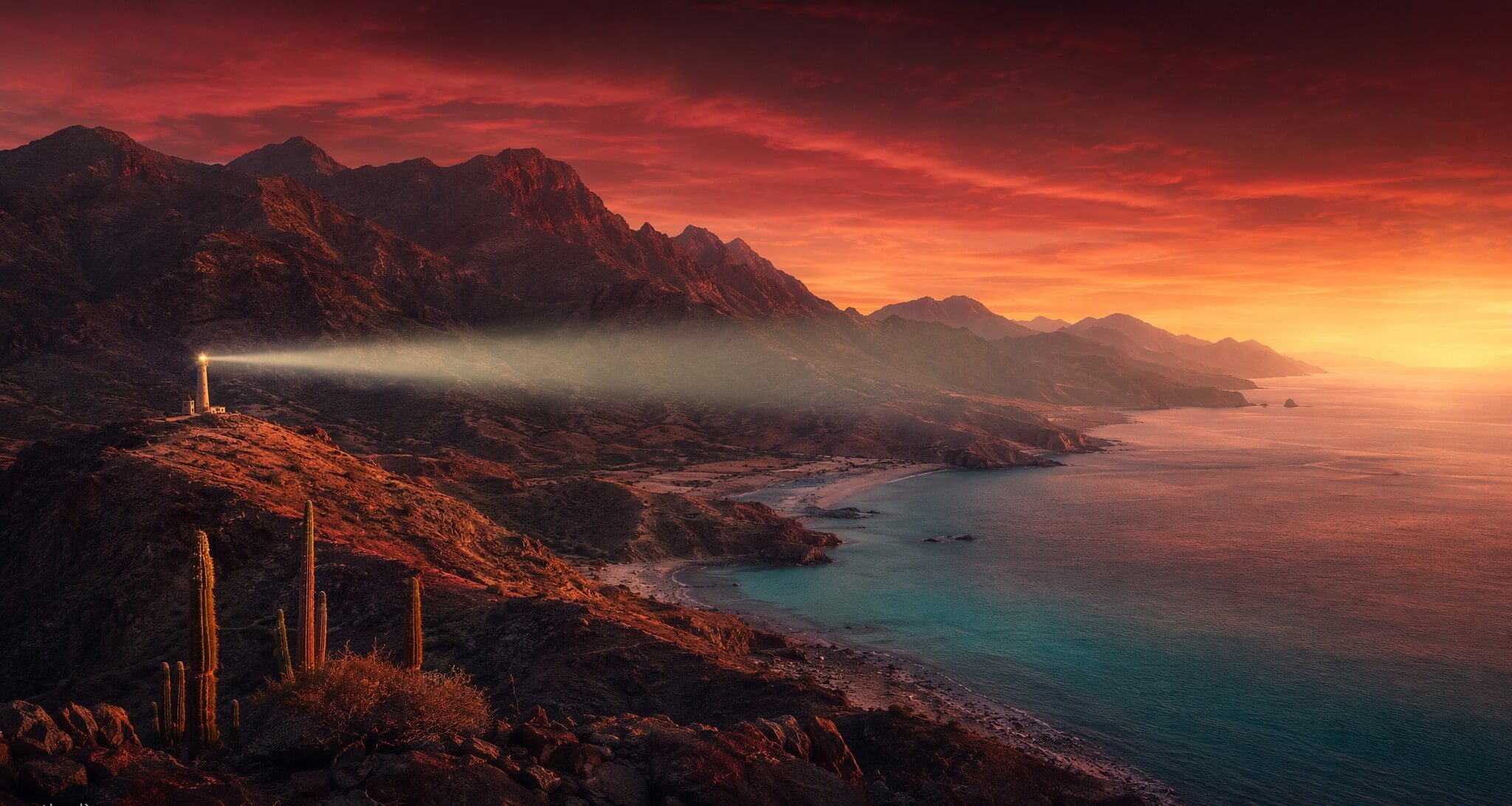 Costa de Baja California Sur al amanecer con un faro iluminando el Mar de Cortés